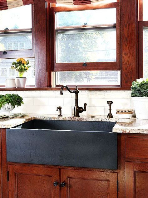 A composite granite sink is an engineered product manufactured using a mix of granite stone dust and acrylic resins molded into sink form. Kitchen Sink Decor Ideas, Rustic Kitchen Sinks, Apron Sinks, Kitchen Sink Remodel, Black Granite Sink, Kitchen Sink Decor, Kitchen Sink Design, Apron Sink Kitchen, Apron Sink