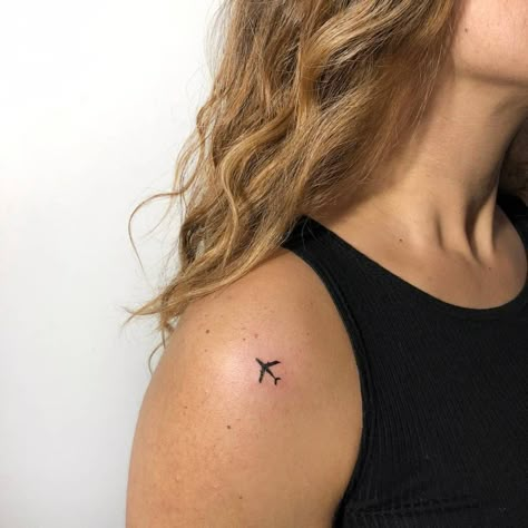 Minimalist airplane tattoo on the shoulder Memorial Heart Tattoo, Small Hip Tattoos Women, Tattoo On The Shoulder, Women's Shoulder Tattoo, Travel Tattoo Small, Hip Tattoo Small, Airplane Tattoo, Plane Tattoo, Cute Simple Tattoos