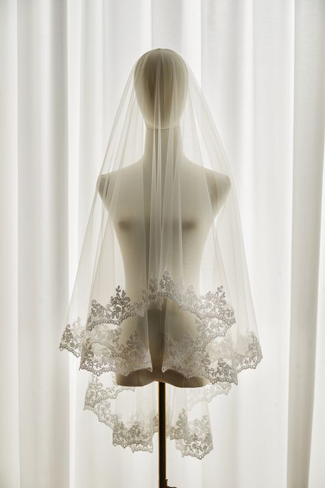 Elegant venice lace veil, it is made with scallop venice lace and soft tulle which allowing your dress to see through. The pattern is designed with delicate scalloped floral and leaf lace edge. Brides can wear the veil in mantilla or drop style.  A sewn metal comb is on it. It will secure the veil on the head. Please contact us if you do not need it. We can make it a mantilla veil ,1 tier, this link please: https://www.etsy.com/listing/1628309150/lace-edge-bridal-veil-mantilla-lace?ref=listings_ Veils Bridal Fingertip Lace, Wedding Veil Floral Lace, Lace Drop Veil, Victorian Wedding Veil, Vintage Wedding Veils, Veil Aesthetic, Bridal Veil Blusher, Vintage Wedding Veil, Vintage Veils Bridal