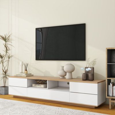 Modern TV stand with multi-functional storage keeps your TV area neat and organized. Whether you use your TV in your living room, bedroom, or entertainment room, this TV stand will meet your storage needs. Not only does it accommodate TVs up to 80 inches, but it also offers plenty of storage space to make your life easier. Color: White | Fu Owner 70.8" W Storage Credenza Wood in White | 16.1 H x 70.8 W x 15 D in | Wayfair