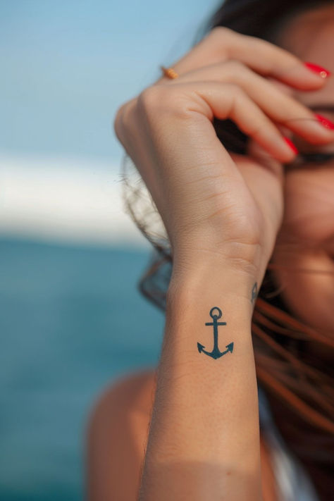 Looking for stunning wrist tattoo design ideas?! This anchor wrist tattoo is TOO gorgeous. From subtle and elegant to bold and creative, find the perfect wrist tattoo to match your style. Anchor Tattoo Placement For Women, Anchor Tatoos Woman, Anchor Wrist Tattoo, Hope Anchor Tattoo, Fineline Anchor Tattoo, Navy Anchor Tattoos For Women, Navy Mom Tattoo Ideas, Small Anchor Tattoos For Women, Compass Anchor Tattoo Design