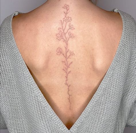 Spine Tattoos For Women Placement, Spine Cherry Blossom Tattoos, Delicate Floral Spine Tattoo, Fine Like Spine Tattoo, Simple Floral Back Tattoo, Spine Tattoos Cherry Blossoms, Small Floral Spine Tattoo, Spine Tattoo Cherry Blossom, Minimalist Back Tattoo Women Spine