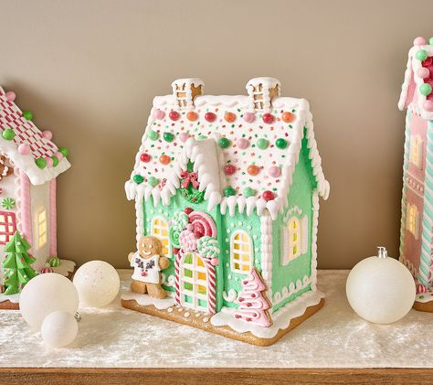 The sweetest part of the holidays? Celebrating with family and friends! But this illuminated gingerbread house -- overflowing with piped pastel details, peppermint candies, and not-so-cookie-cutter accents -- is a close second. From the Valerie Parr Hill Collection. Pastel Christmas Village Houses, Pastel Christmas Village, Painted Gingerbread Houses, Pastel Gingerbread Christmas Decor, Gingerbread House Christmas Decorations, Gingerbread Kitchen Decorating Ideas, Polymer Clay Gingerbread House, Wood Gingerbread House, Pastel Gingerbread House