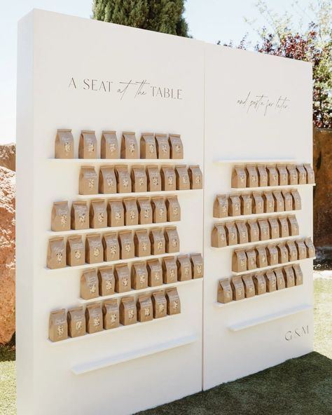 One of our favourite wedding trends of 2024 has to be Interactive Seating Charts 🥂 From flower or foliage walls filled with food or drink escort cards and or items that double up as favours, to the fun ‘Ring for Cocktails’ concept where guests ring a bell, and suddenly, a mysterious hand appears, offering them a cocktail or, glass of Champagne! Click the link in our bio for The Hottest Wedding Trends for 2024: https://brnw.ch/21wKWUd Pic 1: @andimejiaco Pic 2: @itspapercliche & @ellilaurenw... Interactive Seating Chart, Interactive Seating Chart Wedding, Champagne Seating Chart, Orchid Wedding, Glass Of Champagne, Trends For 2024, Wedding Drink, Double Up, Seating Chart Wedding