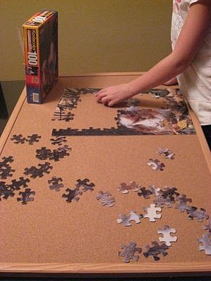 use a cork bulletin board to make puzzles portable. Brilliant. And it slides right under the kids' beds (or the couch) when it's time to clean up and the puzzle's still a work in progress. Pinterest comes through with another cheap solution! Jigsaw Puzzle Board, Puzzle Board Ideas, How To Make A Puzzle Board, Puzzle Table Ideas, Puzzle Board Diy, Diy Puzzle Table, Puzzle Tables, Jigsaw Puzzle Table, Puzzle Storage