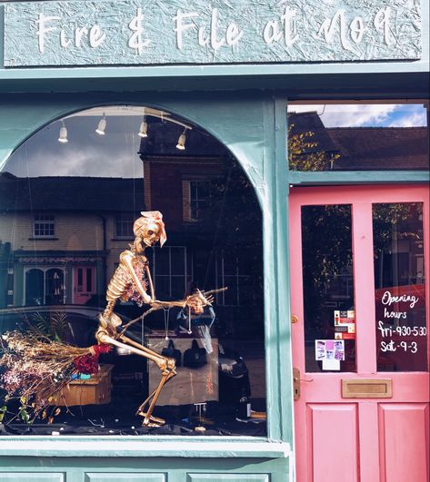 Halloween shop window display. Golden skeleton riding a broom wearing jewellery from Fire & File Metal Design Halloween Shop Window Display Ideas, Window Display Halloween, Halloween Window Display Retail, Halloween Shop Window Display, Halloween Store Window Display, Halloween Store Windows, Halloween Shop Window, Vitrine Halloween, Creative Window Display