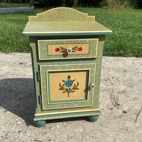 Tyrolean Region Austrian Folk Art Furniture. Armoire, chest of drawers, and nightstand. Original Floral paintings on a mixed green field dates this to the earliest times this furniture was produced in Austria. Crafted by painted by hands by Germans who fled across the Alps in an attempt to escape the war. All research shows this furniture is very limited in the United States. We are offering numerous pieces on Chairish please see our entire collection before its gone. Germanic Folk Art, Painted Drawers Ideas Aesthetic, Folk Furniture Painting, Hand Painted Folk Art Furniture, Medieval Folk Art, Folk Art Furniture Painting Ideas, Folk Art Bedroom, Hand Painted Chest Of Drawers, Cottage Core Nightstand