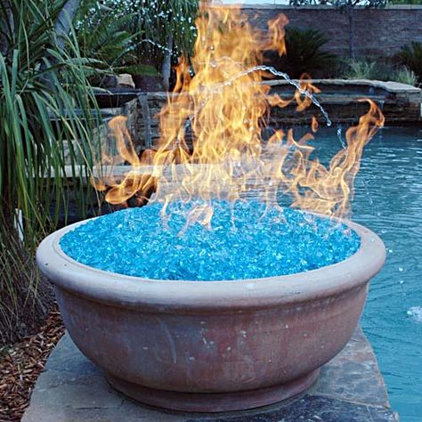 A fire pit using "fire glass." Our local recycle center crushes all glass bottles they receive, yielding a colorful, pebbly mix...and they give it away to the public. Yet another project... Have Inspiration, Fire Glass, Kit Home, Cool Stuff, Tiny Homes, Outdoor Projects, A Fire, My New Room, Garden And Yard