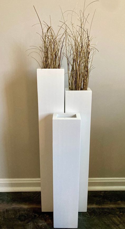 "ITEM: Set of 3 floor vases: You will receive a 32\", 28\", and 24\" vase, Your choice in color. SIZE: Outer dimensions are 3.5\"x5\". Inside dimensions are 2\" x 3.5\" The most popular color is the white option! This size is perfect for twigs or grasses. Check out our other listings for different set options! PROCESSING TIME: Depending on the number of orders I have in at a given time, it takes me 2-3 weeks to process this item. SHIPPING: Is included in the price. Depending on where you live, shipping with FedEx can take between 2-9 days for this item to arrive. RETURNS: If you are extremely unsatisfied with your order, a return must be made within 7 days of receiving the order. Customers are responsible for the cost of packaging and shipping the item back to Fort Wagler Woodworking. A re Large Floor Vase Arrangements, Floor Vases Decor Tall, Large Floor Vase Decor, Diy Floor Vase, Tall Vase Decorating Ideas, Floor Vases Decor, Big Floor Vases, Rustic Floor Vase, Curved Fireplace