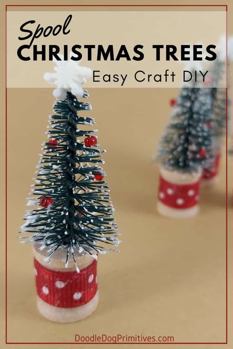 Make these adorable Christmas trees with wooden spools and bottle brush trees. Perfect for ornaments or to add to your holiday display! #countrychristmas #christmascrafts #doodledogprimitives | DoodleDogPrimitives.com Wood Spool Craft Ideas, Crafts Using Wooden Thread Spools, Repurpose Wooden Spools, Wooden Spools Christmas Ornaments, Christmas Wooden Bead Crafts, Thread Spool Ornaments, Thread Spools Ideas, Wooden Spool Ornaments, Spools Ideas