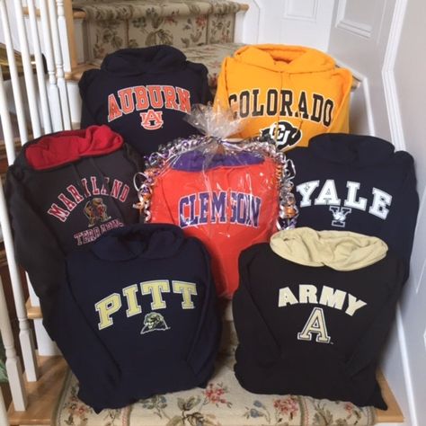 "College Sweatshirt throw pillows make the best unisex Graduation gifts, perfect for any dorm room!! All Colleges and Universities are available.  New, quality cotton/poly blend hooded sweatshirts are cut and sewn and stuffed with a twin sized polyester fiberfill pillow. Pillow is sewn inside, no openings or zippers.  All pillows are gift wrapped in clear cellophane with coordinating ribbon and gift tag. College hoodie design and colors will vary based on availability.  Please indicate full name College Gear, College Hoodies, College Sweatshirt, Pro Sports, Sports Teams, Colleges And Universities, Hoodie Design, Gift Tag, Graduation Gifts