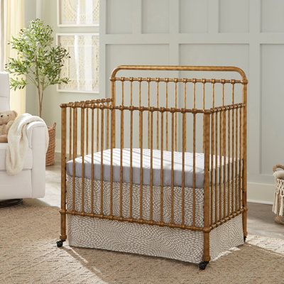 Our best-selling Winston Crib has been reimagined for small spaces – perfect for nursery nooks, shared bedrooms, and grandma's guest room. It's a smart alternative to a bassinet that will last longer and convert to a toddler bed, daybed, and twin bed as your little one grows. The Winston 4-in-1 Convertible Mini Crib features a portable design with removable casters, premium steel, and traditional metal casting at the joints to emulate vintage American style. Namesake Color: Vintage Gold Namesake Winston 4-in-1 Convertible Crib - Cribs in Vintage Gold | Size Mini | Perigold Metal Crib, Nursery Nook, Adjustable Mattress, Nursery Crib, Blue Nursery, Mini Crib, Shared Bedrooms, Convertible Crib, Twin Size Bedding