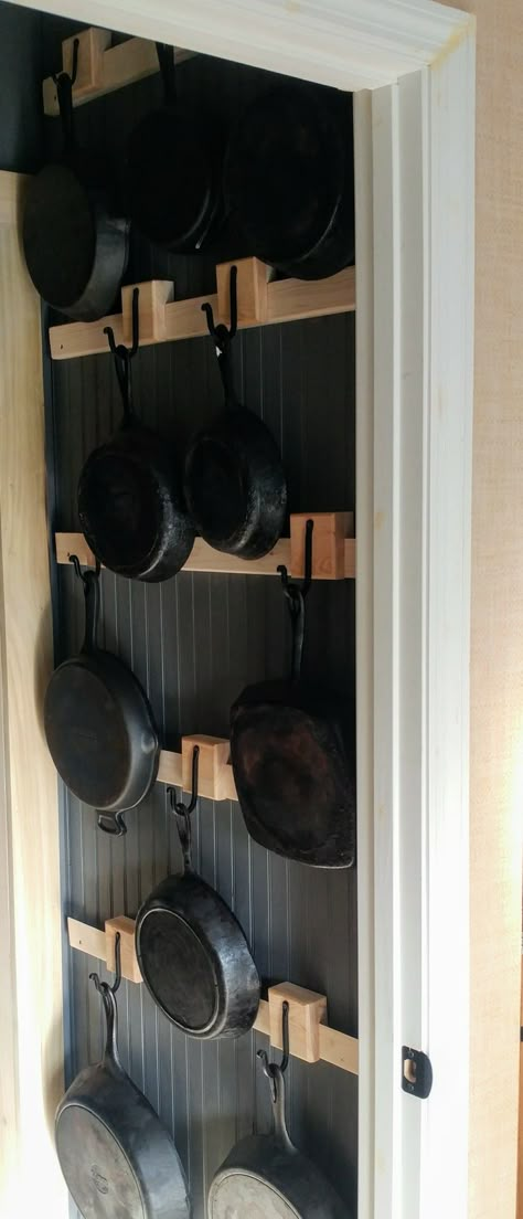 My husband made these wonderful French cleat hangers for my cast iron. Fry Pan Storage, Cast Iron Skillet Wall Hanger, French Cleat Kitchen, Cast Iron Wall Display Ideas, Cast Iron Pan Storage, Cast Iron Wall Storage, Cast Iron Pan Wall Display, Cast Iron Wall, Cast Iron Storage