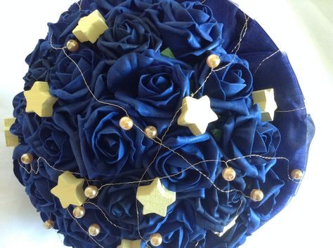 A wedding bouquet called "Starry Nights", with navy roses, yellow stars and gold beads to represent moons and planets. Celestial Themed Wedding Bouquet, Starry Night Bouquet, Starry Night Wedding Theme, Quinceanera Bouquet, Stars Wedding, Galaxy Wedding, Samantha Wedding, Starry Night Wedding, Roses Yellow