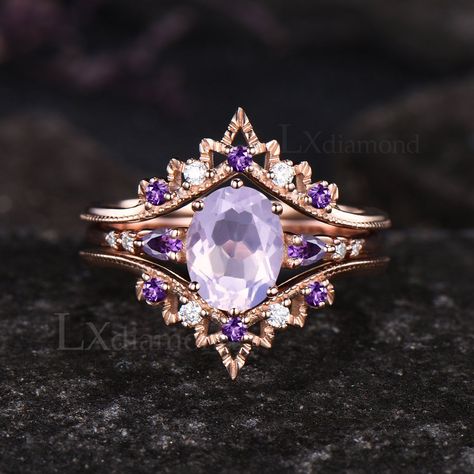 Item description ✦ Handmade, high-quality item! ✦ Material: 925 sterling silver, Solid 10k/14K/18K GOLD (can be made in white/rose/yellow gold) Engagement ring ✦ Center stone: Natural Lavender Amethyst. ✦ Size/Weight: 6x8mm Oval Cut ✦ Side stones: Pear Cut Natural Amethyst and Round Cut Moissanites Wedding band ✦ Gemstones: Round Cut Moissanites and Natural Amethyst Any ring size can be made,if the ring size is not in the option list ,contact me. As it is handmade,it needs 2-4 weeks to finish an Purple Wedding Rings, Shiney Things, Pretty Engagement Rings, Amethyst Engagement Ring, Lavender Amethyst, Amethyst Ring Engagement, Cute Engagement Rings, Future Engagement Rings, Purple Rings