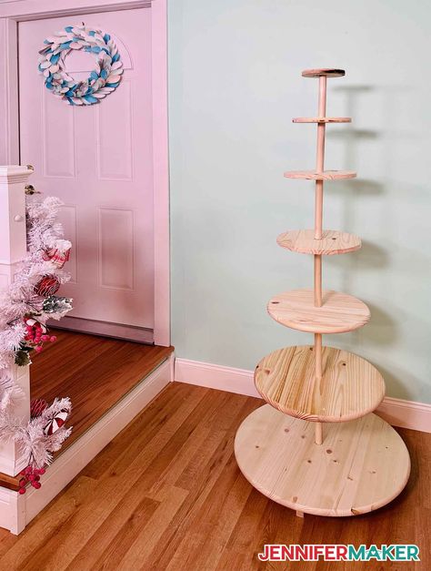 DIY Christmas tree display stand made from wood tabletops and 1" dowels Diy Christmas Tree Village Stand, Diy Christmas Tree Shelf, Christmas Tree Village Display Diy, Diy Tabletop Christmas Tree, How To Display Ornaments At A Craft Show, Christmas Tree Village Stand, Christmas Tree Stand Diy, Spinning Christmas Tree, Rotating Christmas Tree Stand