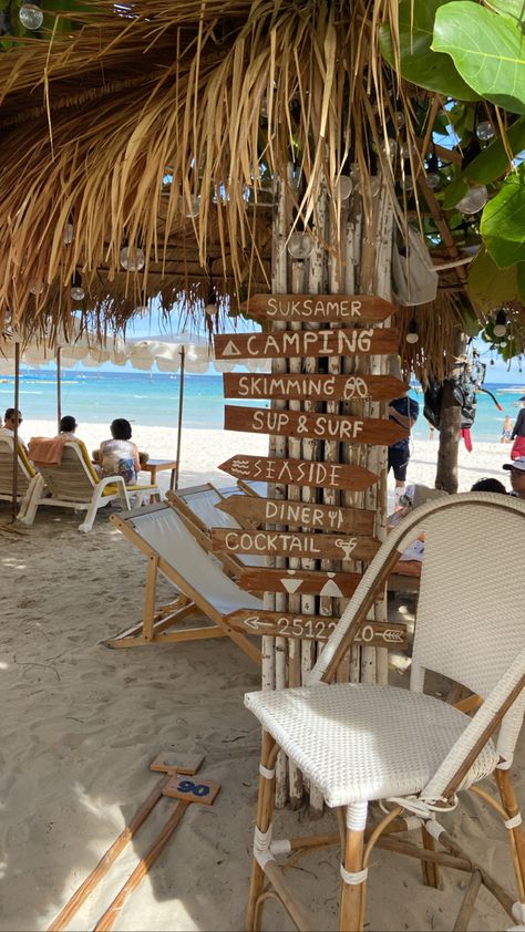 Beach signs with beach chair in neutral colors in a beach with clear blue waters in the background Pattaya Beach Aesthetic, Pattaya Thailand Aesthetic, Thailand Beach Aesthetic, Thailand Pics, Bangkok Beach, Thailand Aesthetic, Beach In Thailand, Pattaya Beach, Thai Beach