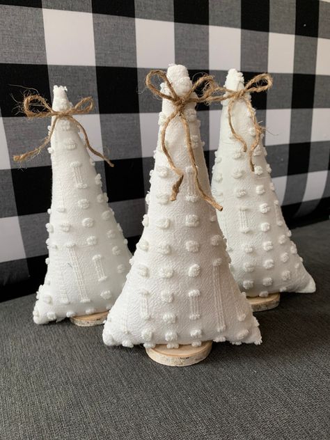 Sweet fabric Christmas trees in vintage chenille fabric. You will receive 3 of these cute fabric trees.  They are attached to real birch wood and topped with a jute ribbon and ranging from 8-9 inches tall and 4-5 inches wide.   Please note that we try to recycle shipping materials as much as possible.  All items are handmade by me in the USA. Follow us for our latest listings and coupons  IG - @Omievedesigns Facebook - https://www.facebook.com/omievedesigns Primitive Christmas Tree, Chenille Crafts, Buffalo Plaid Christmas Tree, Fabric Tree, Christmas Tree Pillow, Fabric Christmas Trees, Reindeer Decorations, Plaid Christmas Tree, Christmas Tree Set