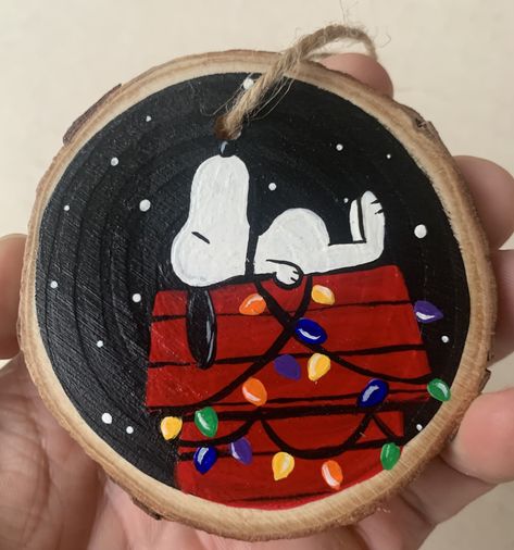 Snoopy is now available!  Ornaments are hand-painted to order and are made freehand (without the use of stencils or tracing). are made from 3-4 inch wood slices and are ready-to-hang with twine, unless otherwise pictured. Wood ornament shapes can vary a bit but add to the uniqueness of a product painted just for you! All ornaments are painted with acrylic paint and sealed with polycrylic polyurethane.  Upon order, your product will take 5-7 business days for production, and will then be shipped. Snoopy Diy Ornaments, Christmas Wood Art Painted, Christmas Painting Ornaments Ideas, Diy Ornaments Christmas Paint, Diy Snoopy Christmas Decorations, Wood Ornament Crafts For Kids, Grinch Wood Ornaments, Painted Wood Cookie Ornaments, Hand Painted Wood Slice Christmas Ornaments