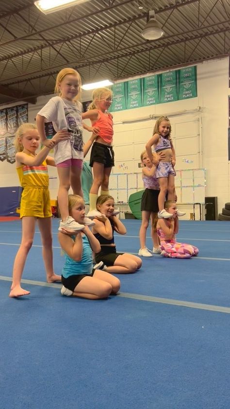 57K views · 12 shares | The iconic Mini Mafia partner stunt! Our younger athletes blow us away with their talent every day and we can not wait for the future of this gym. The dedication and drive of our athletes is unmatched. • • • #risewithrebelnation #season16 #rebelscheerleading #proudlypurple #saskcheer #canadaincheer #stunting #stunts | Rebels Cheerleading Athletics | Sam Marshall · Jumble Cheerleading Level 1 Stunts, 9 Person Cheer Stunts, Small Cheer Pyramids, Partner Cheer Stunts, Easy Cheer Stunts For Kids 2 People, Mini Level 1 Cheer Stunts, Elementary Cheer Stunts, 3 Man Stunts, Mini Cheer Stunts