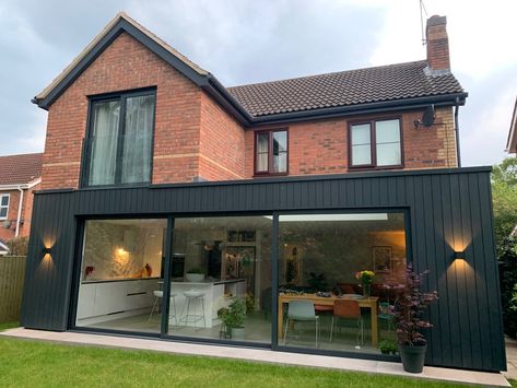 This rear extension to a detached property in Leicester creates a large open plan living kitchen to the rear of the property which opens onto the garden.  The ground floor is clad in black vertical timber with the master bedroom being extended above with a Juliet balcony looking over the garden. Rear Kitchen Extension, Rear Extension Ideas, Small House Extensions, Flat Roof Extension, Single Storey Extension, Extension Plans, Garden Room Extensions, House Extension Plans, Juliet Balcony