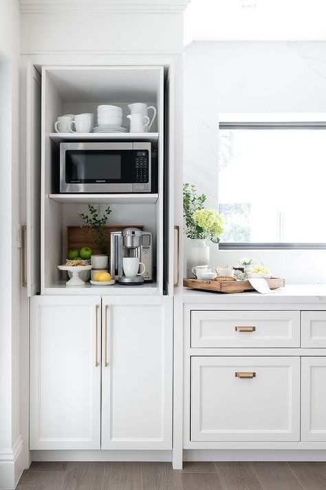 Kitchen coffee station hidden by fold-in white shaker cabinet pocket doors. Kitchen Drink Bar Ideas, Ikea Coffee Bar, Office Kitchens, Kitchen Coffee Station, Coffee Station Kitchen, Cottage Kitchen Design, Home Coffee Stations, Messy Kitchen, Easy Coffee