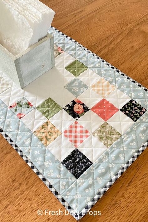 mini charm squares table runner quilt using scraps of jelly roll strips, easy mini charm squares quilt pattern Mini Charm Square Quilts, Mini Charm Pack Table Runner Patterns, Table Runner Sewing Patterns Free, Quilt As You Go Table Runner, Jelly Roll Table Runner Patterns Free, Mini Charm Pack Projects, Easy Placemats, Charm Pack Quilt Patterns, Charm Quilts