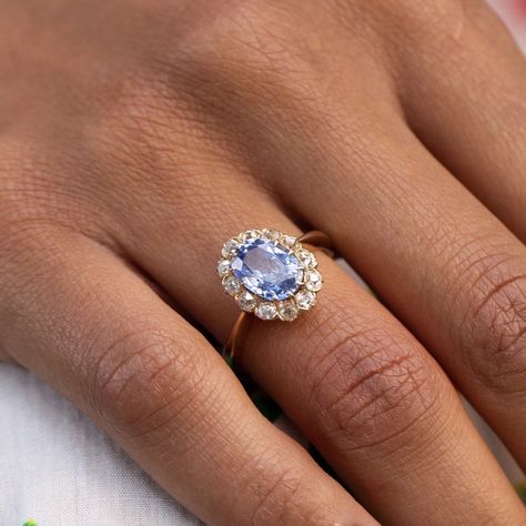 Antique Jewelry Victorian Rings, Blue Diamond Gold Ring, Saphire Engament Ring Set Light Blue, Indy Blue Wedding Ring, Oval Diamond With Sapphire Side Stones, Light Blue Stone Engagement Ring, Engagement Rings Old Fashioned, Gold And Blue Ring, Cornflower Blue Engagement Ring