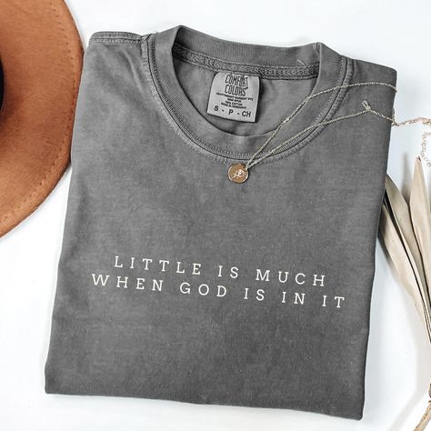 Shop for other awesome stuff: https://athreadoffaithco.etsy.com Little is Much T-Shirt Celebrate the power of faith with our Comfort Colors t-shirt featuring the simple yet profound message: "Little is Much When God is in It." Designed in a minimalistic font for a clean and timeless look. Details: Material: 100% ring-spun cotton Feel: Soft-washed, garment-dyed for extra coziness Fit: Relaxed, unisex sizing (size up for an oversized fit) Design: Minimalistic font with a powerful faith message Shi Cute Christian Tshirts, Christian Tshirt Design Ideas, Bible Verse Shirts, Bible Verse Inspirational, Christian Shirts For Women, Bible Verse Tees, Bible Shirts, Christian Shirts Designs, Gift Idea For Women