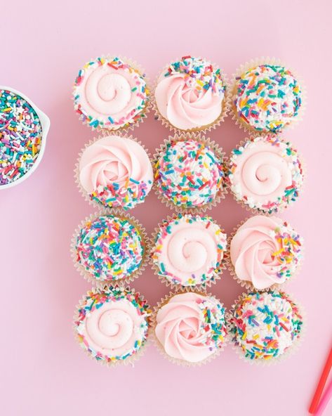 Ever wondered, how many sprinkles are needed to cover your cupcakes? We've got the answer for you! Just like in our sprinkle cake post, we show you a few different coverage options and how much is used for a dozen and more cupcakes. Don't be left over buying anymore, use our sprinkle cupcakes chart to see exactly how much you need for full coverage, rolling the edges for a perfect border, and side trimmed dipped sprinkle cupcakes! #sprinklecupcakes #rainbowcupcakes #cupcakesprinkles Sprinkle Dipped Cupcakes, Cupcakes Rolled In Sprinkles, Birthday Cupcakes Sprinkles, Cupcakes For 2nd Birthday, Two Sweet Theme Cupcakes, Sprinkle Themed Cookies, Two Sweet Birthday Cupcake Ideas, Sprinkle Shower Cupcakes, Third Birthday Cupcakes