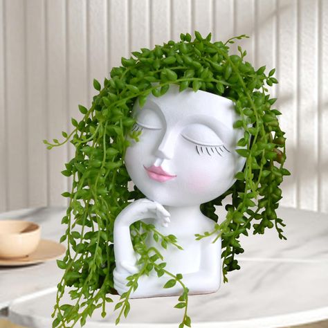 PRICES MAY VARY. ❤ 【Too Cute to Make You Smile】She is unique and fun, It will make us smile every time we see her. （Plants are not included） ❤ 【Cute Face Planter with Drinage Hole】Bottom hole is definitely needed for living plants. It will make well draining to prevent the roots rot.(No seeds or plants) ❤ 【Small & Lightweight 】 Resin material makes the planter solid for outdoor plants, and it's also small size(6.6 inches tall, 2-3.5 inches oval openning diameter, ) and lightweight for indoor pla Crafts With Crystals Pots & Planters, Women Face Vase, Womans Head Vase, Cool Gifts For Plant Lovers, Gifts For Succulent Lovers, Cute Planters Pots, Spring Decorations For The Home, White Vase Decor, Outdoor Succulents