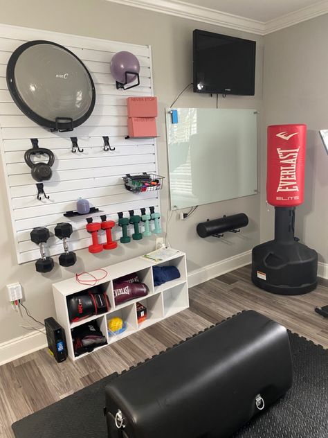 Use a slat wall to organize your workout room, while getting your weights and other equipment on the wall. 

#homedesign #workout #workoutideas #workoutroom #organization #homeinterior #homeworkout #homeinspo #ad Fitness Storage Home Gyms, Workout Set Up At Home, Gym Room Inspiration, Compact Gym Small Spaces, Garage Workout Space, Gym Setup Ideas, Half Garage Gym Ideas Small, Garage Gym Ideas Small, Small Workout Room