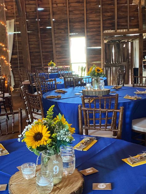 Navy Blue And Yellow Centerpieces, Royal Blue And Sunflower Quinceanera, Blue Roses And Sunflowers Centerpiece, Royal Blue And Yellow Table Setting, Blue And Yellow Sunflower Wedding, Blue Yellow Centerpieces, Navy Blue And Yellow Party Decorations, Blue Roses And Sunflowers Wedding, Royal Blue And Sunflower Wedding Decor