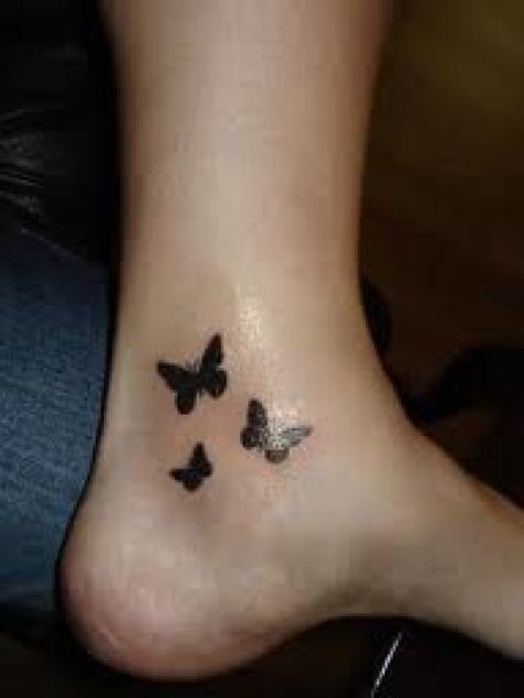 One of the most popular tattoo designs in the world is the butterfly tattoo. The butterfly tattoo is mainly worn by women. Butterfly tattoos can also hold symbolic importance to those who wear this beautiful tattoo. Just like all animal tattoos, the... Butterflies Silhouette, Butterfly Ankle Tattoos, Tiny Butterfly Tattoo, Butterfly Tattoo Cover Up, Black Butterfly Tattoo, Silhouette Tattoo, Butterfly Tattoo On Shoulder, Ankle Tattoo Designs, Butterfly Tattoos For Women