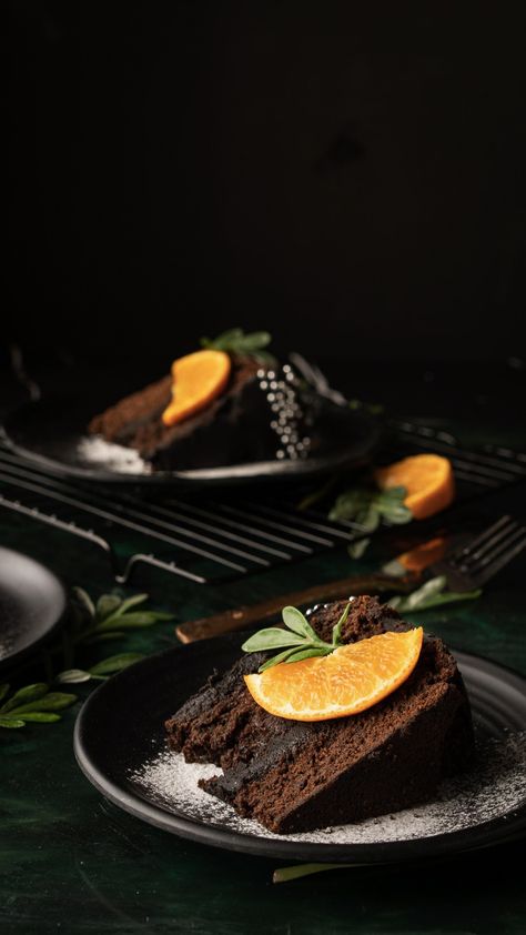 Dark chocolate cake with chocolate ganache decorated with fresh orange. Orange Chocolate Cake Decoration, Chocolate Cake Plating, Dark Chocolate Aesthetic, Cake Shoot, Chocolate Cake Images, Food Photography Dessert, Food Photography Composition, Eggless Chocolate Cake, Orange Chocolate Cake