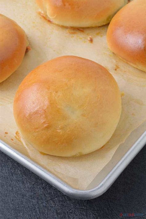 Freshly baked bread bun on a tray Filled Buns Savory, Hamburger Stuffed Buns, Stuffed Brioche Buns, Meat Buns Recipe Ground Beef, Meat Stuffed Buns, Beef Buns Recipe, Meat Stuffed Bread Rolls, Stuffed Buns Recipe Meat, Meat Filled Buns