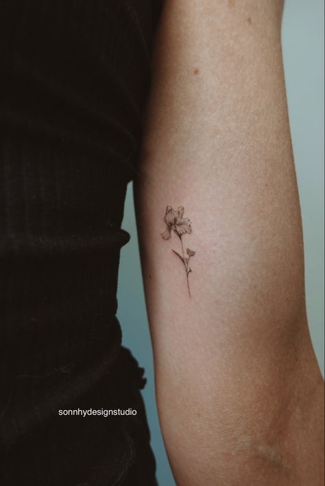 Inner Bicep Fine Line Tattoo, Delicate Iris Tattoo, Microrealism Tattoo Flower, Tiny Flower Hand Tattoo, Flower Iris Tattoo, Iris Hip Tattoo, Small Fine Art Tattoo, Minimalist Iris Flower Tattoo, Bicep Fine Line Tattoo