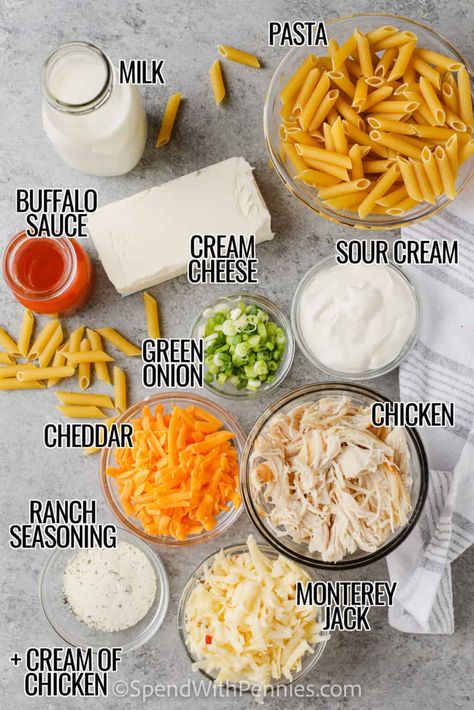 This cheesy buffalo ranch pasta bake is so delish. Pasta and chicken are cooked in a tangy white sauce made with cream cheese and sour cream. Buffalo sauce is added for a spicy kick and then it is topped with two kinds of cheese and baked to cheesy perfection. This buffalo chicken pasta bake is so easy and so tasty!  #buffaloranchpastabake #buffalochickenpasta #buffalochickenpastabake #spendwithpennies Buffalo Chicken Baked Ziti, Sour Cream Chicken Pasta, Buffalo Chicken Pasta Stovetop, Buffalo Chicken Pasta Casserole, Buffalo Pasta Sauce, Buffalo Pasta Bake, Creamy Buffalo Chicken Pasta, Buffalo Chicken Pasta Recipes, Buffalo Ranch Pasta