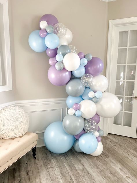 When it comes to planning a winter party, creating the right atmosphere is key. You want your guests to feel cozy, festive, and excited. One way to achieve this is through the use of warm lighting. Hang string lights across the room or place candles on tables to create a warm and inviting glow. Elsa Balloon Decoration, Elsa Balloon Garland, Frozen Balloon Decorations, Winter Balloons, Ice Princess Party, Frozen 3rd Birthday, Frozen Balloons, Frozen Birthday Party Decorations, Elsa Birthday Party