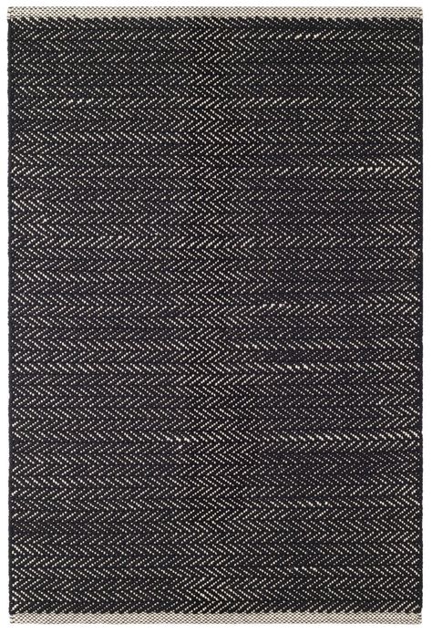 Part of our Designer Favorites collection of go-to rugs in timeless styles and a variety of durable constructions. Our best-selling herringbone woven cotton rug is back with a beautiful update. In a timeless black hue, this classic menswear inspired pattern is the perfect way to add a touch of understated pattern to bedrooms, hallways, stairs, and more.Product Overview Color: Black Materials: 100% Cotton Available Sizes: 2' 6" x 12' 2' 6" x 8' 2' x 3' 3' x 5' 4' x 6' 5' x 8' 6' x 9' 8' x 10' 9' Farrow & Ball Wallpaper, Thibaut Wallpaper, Exterior Stain, Dash And Albert Rugs, Farrow And Ball Paint, Dash And Albert, Luxury Vinyl Plank Flooring, Cotton Area Rug, Luxury Vinyl Tile