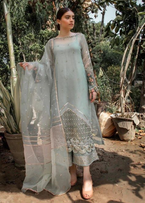 Color: Sage-greenish Fabric: Organza Work Technique: Flower spray and embroidery Description: Gorgeous Organza shirt with sequence flower spray and embroidered sleeves. Accentuated by Silk lining. Paired with gotta border Silk Pants, organza dupatta with multi color borders and spray all over.. This is a 3 piece outfit. Includes: Shirt Lining Pants Dupatta Sequence Flower, Organza Suits, Organza Shirt, Pakistani Couture, Pakistani Dresses Casual, Pakistani Fancy Dresses, Embroidered Sleeves, Sleeves Designs For Dresses, Flower Spray