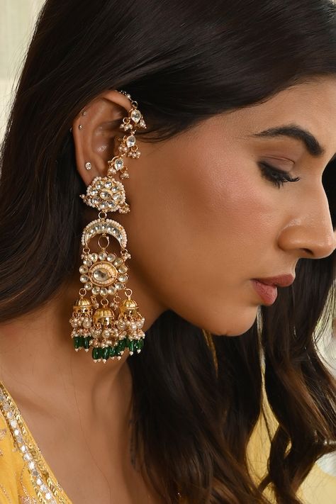 Micro gold plated chandelier earrings with floral, chaand motifs, embellished with kundan, green stones, pearl drops, carved jhumkis and studded kaan chain. - Aza Fashions Kaan Chain, Perfume Store, Green Stones, Kundan Earrings, Green Pearls, Green Stone, Pearl Drop, Brass Color, Chandelier Earrings