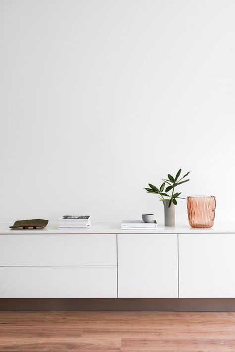 Aug 7, 2018 - Working with limited space, this Port Melbourne home was completely transformed both inside and out by local studio Winter Architecture. Winter Architecture, Port Melbourne, Black And White Furniture, Melbourne Home, Melbourne House, White Sideboard, Living Room White, Livingroom Layout, Living Room Storage