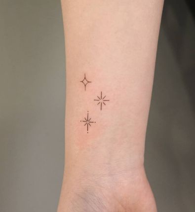 Shoot Star Tattoo, Celestial Stars Tattoo, Star Shine Tattoo, Memorial Star Tattoos, Moon And Three Stars Tattoo, Night Sky Tattoo Minimalist, Magic Stars Tattoo, Calcifer Star Tattoo, 3 Stars Tattoo Design