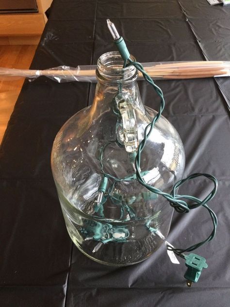 Use an old glass jug to bring your entryway decor to the next level Glass Jugs Decor Ideas Farmhouse, Gallon Glass Jug Ideas, Glass Jugs Decor Ideas, Glass Jugs Crafts, Jugs Decor, Wine Jug Crafts, Glass Jugs Decor, Fire Flies, Jug Decor