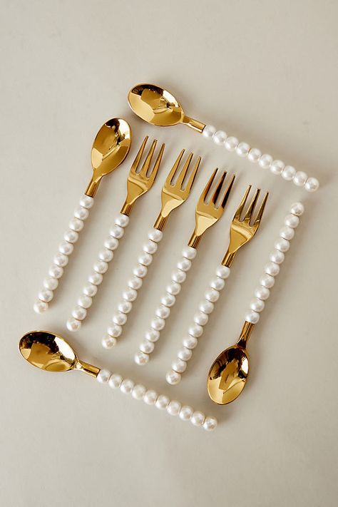 Enjoy a spoonful of sophistication with these fabulously fun gold-plated spoons. Crafted from stainless steel and embellished with chic pearls, they're made for glamorous gatherings, or they'll make a wonderful gift for cutlery collectors! | Pearl Spoons, Set of 2 by Lepelclub in White at Anthropologie Cute Cutlery Set, Pearl Utensils, House Utensils, White Cutlery, Beautiful Kitchenware, Glamorous Kitchen, Kitchen Decor Collections, Crockery Design, Gold Cutlery Set