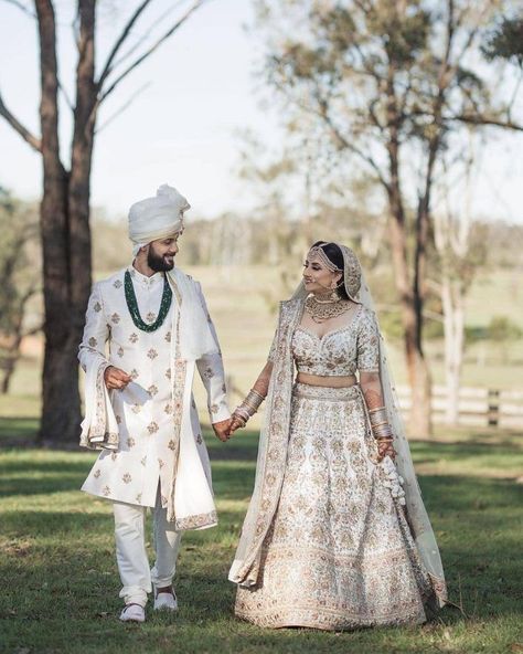 White Bridal Outfits: The 2019 Trend You Need To Check Out | WedMeGood Bride And Groom Indian Wedding Outfit, White Bridal Lehenga, Bride Things, Wedding Fairytale, Couple Wedding Dress, Wedding Lehenga Designs, Indian Bride Outfits, Bridal Lehenga Collection, Wedding Sherwani