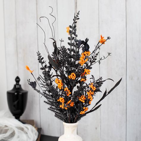 Berry Garlands for sale Halloween Black and Orange Floral and Berry Spray. The Halloween Floral and Berry Spray is the perfect addition to any spooky decor. This spray features a combination of orange and black flowers, along with orange berries. The flowers and berries are attached to a wire stem, making it easy to incorporate into a wreath or centerpiece. The colors and unique design are sure to add a touch of Halloween spirit to any decoration.    It will make a fun addition to your Halloween-inspired arts and craft projects. Place it in centerpiece, floral arrangement or add it to a spooky wreath. Halloween Themed Flower Arrangements, Halloween Floral Centerpieces, Spooky Flower Arrangements, Orange And Black Flowers, Halloween Arrangements, Halloween Flower Arrangements, Halloween Floral Arrangements, Tissue Paper Flowers Diy, Spooky Wreath