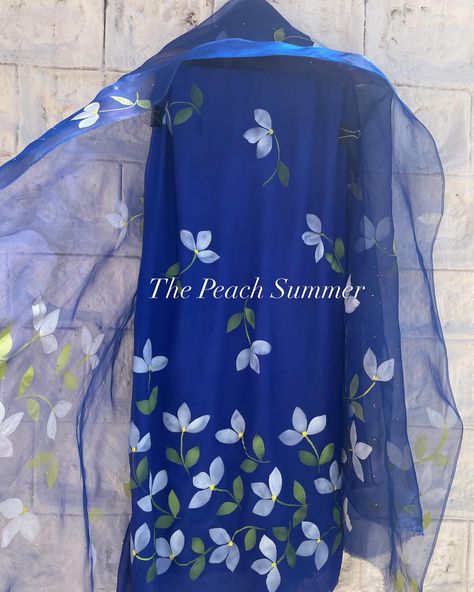 Handpainted Bougainvilleas Suit _______________________________________________ Beautiful blue chiffon suit with handpainted white bougainvilleas to enhance the beauty of the suit. The suit is paired with silk organza dupatta handpainted white bougainvilleas and enhanced with silver mukesh work , to give that extra spark at night. . . . . . Shop Now @thepeachsummer . . . . . . #thepeachsummer #thepeachsummercollection #thepeachsummercollection #handpaintedsuits #bougainvillea #shopnow #bou... Fabric Colour Painting Kurti, Mekhela Chador, Mukesh Work, Fabric Colour Painting, Chiffon Suit, Royal Blue Suit, Fabric Painting Techniques, Hand Painted Dress, Fabric Painting On Clothes