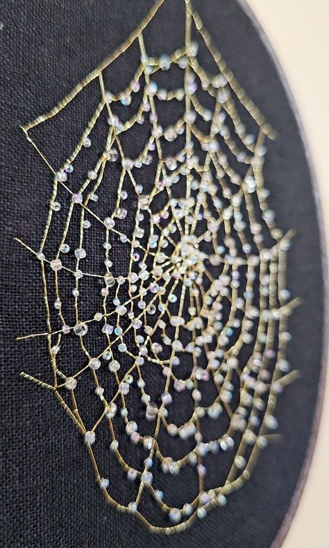 Gold web embroidered on black linen Embroider With Beads, Beginners Quilt Patterns, Macrame Patterns Beginner, Sewing Patterns Plushies, Beaded Spiderweb, Free Blanket Knitting Patterns, Free Sweater Knitting Patterns, Beaded Spider Web, Free Quilt Patterns For Beginners